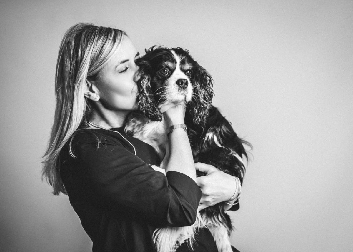 Jutta and pet dog embracing cuddle