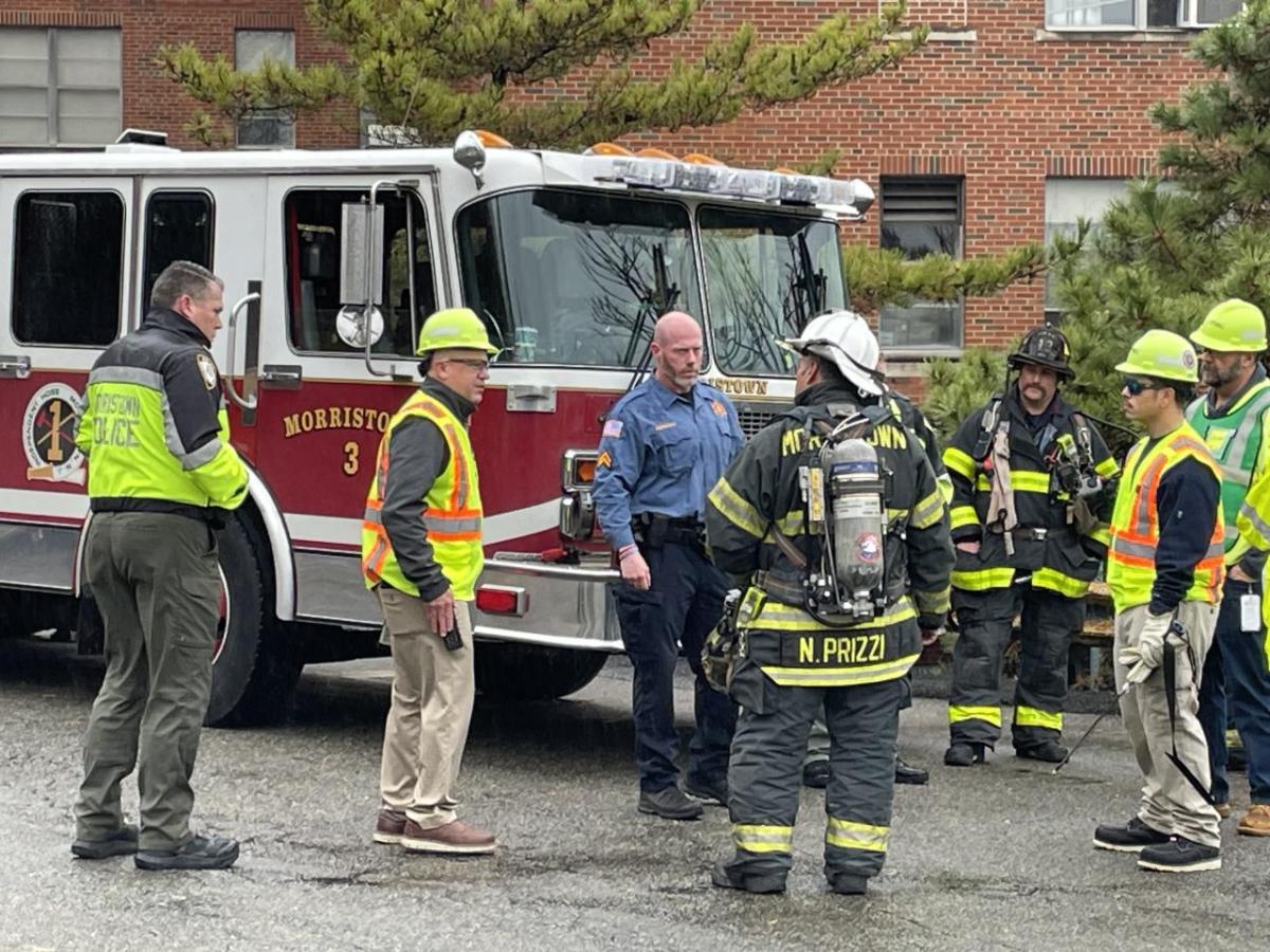 workers talking to firemen