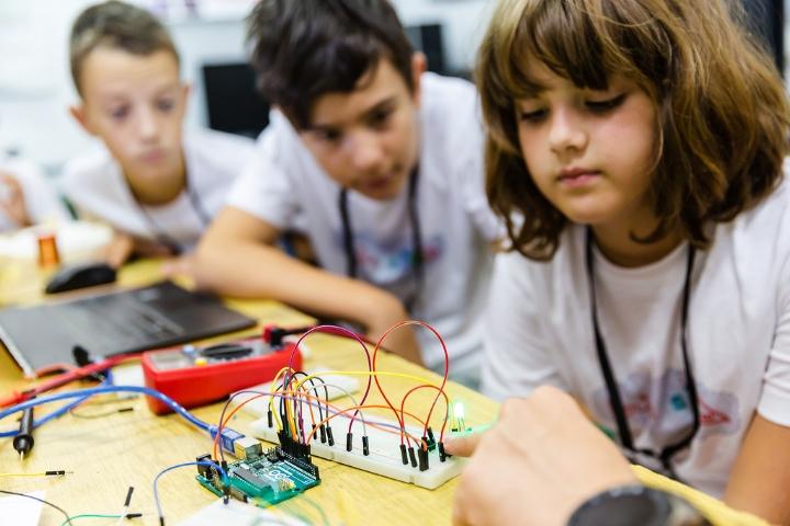 students working on a circuit board