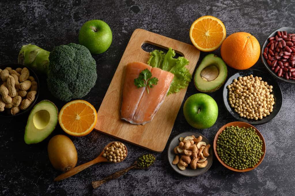 Image by Freepik* Legumes, vegetables and fruits shown on a cutting board.