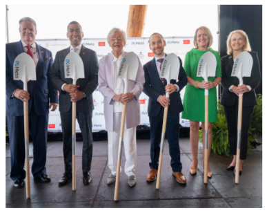 Six people posed with shovels