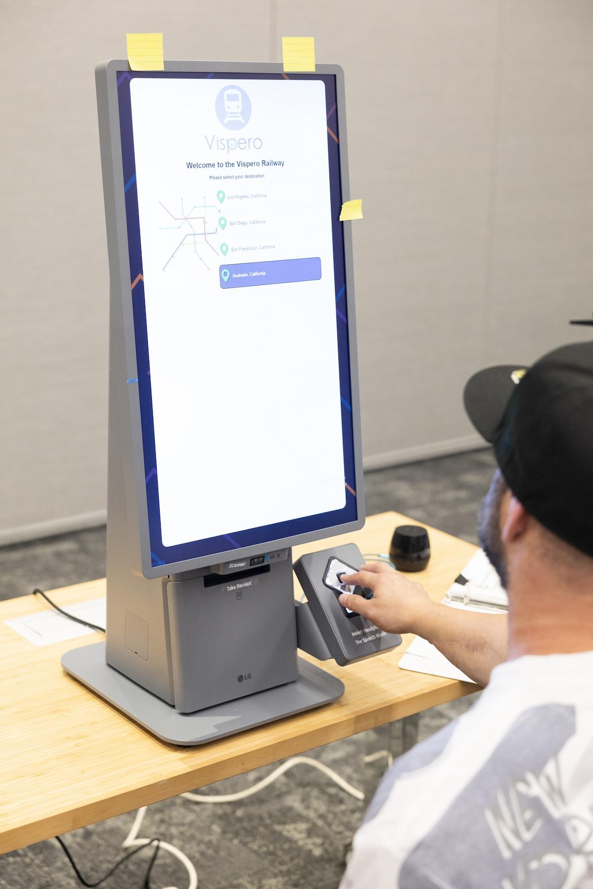 person at Self-Ordering Kiosk