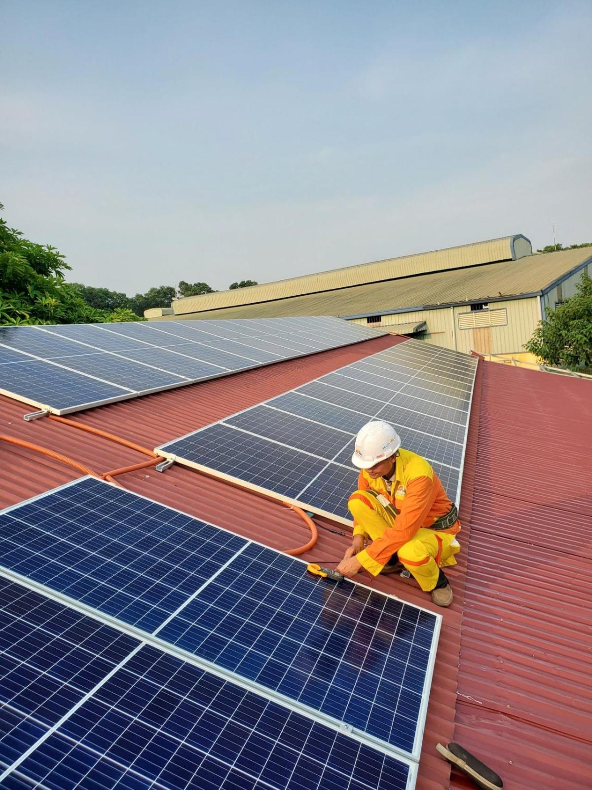 Man working on solar panels