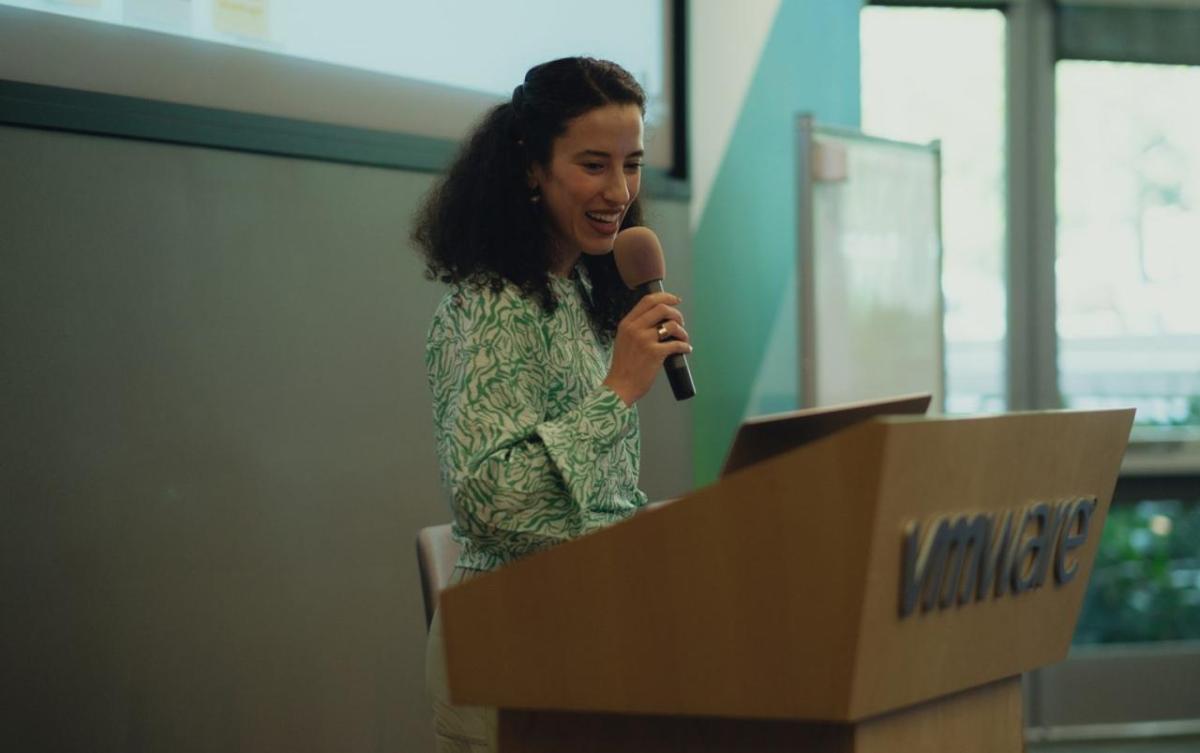 A person at a podium talking into a microphone.