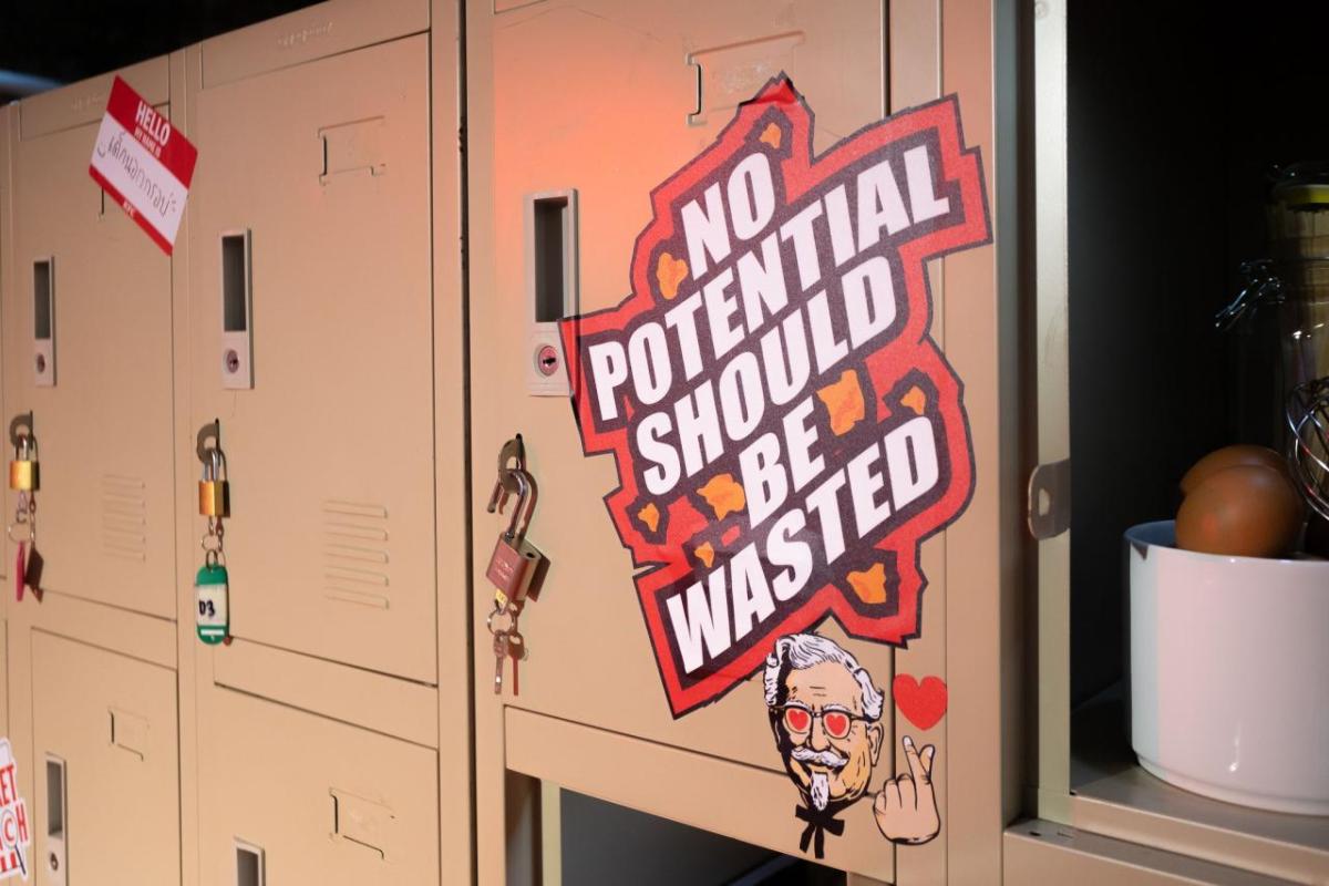 Lockers in a row. One with a sign "No potential should be wasted."