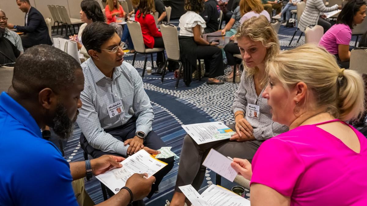 Entergy employees participating in a poverty simulation.