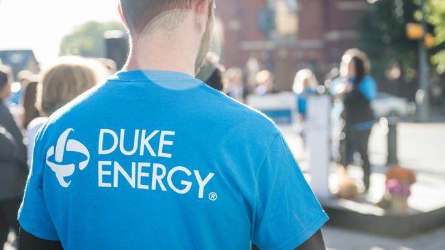 Someone shown from the back wearing a Duke Energy shirt