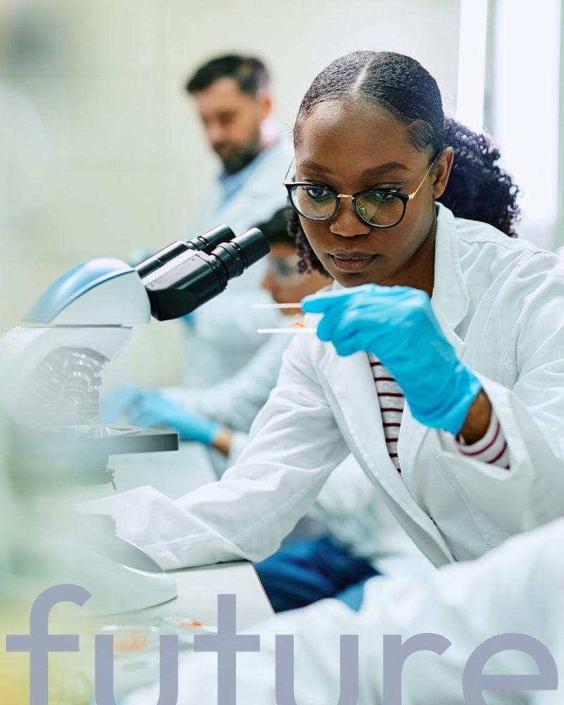 A scientist examining a slide