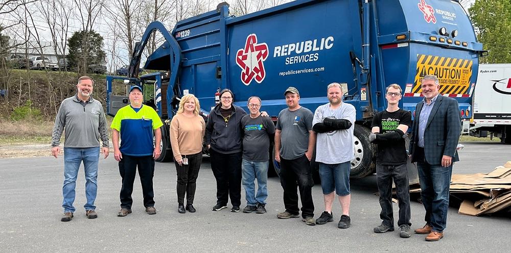 people in front of a republic services truck