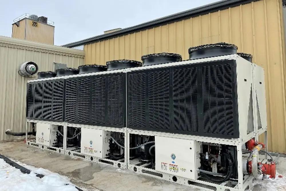 A large, industrial, cooling system outside a building.