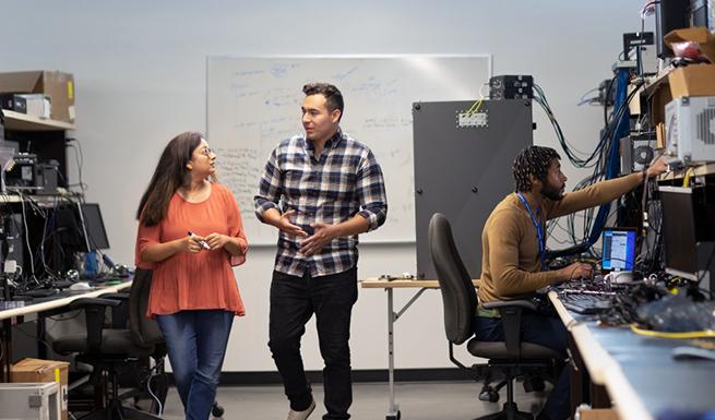 three people in a computer lab