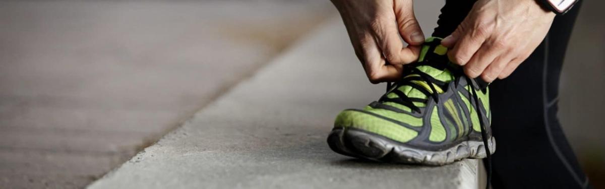 person tying their shoe