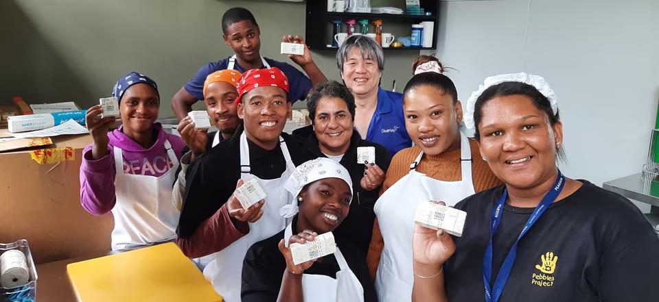 People holding bars of soap