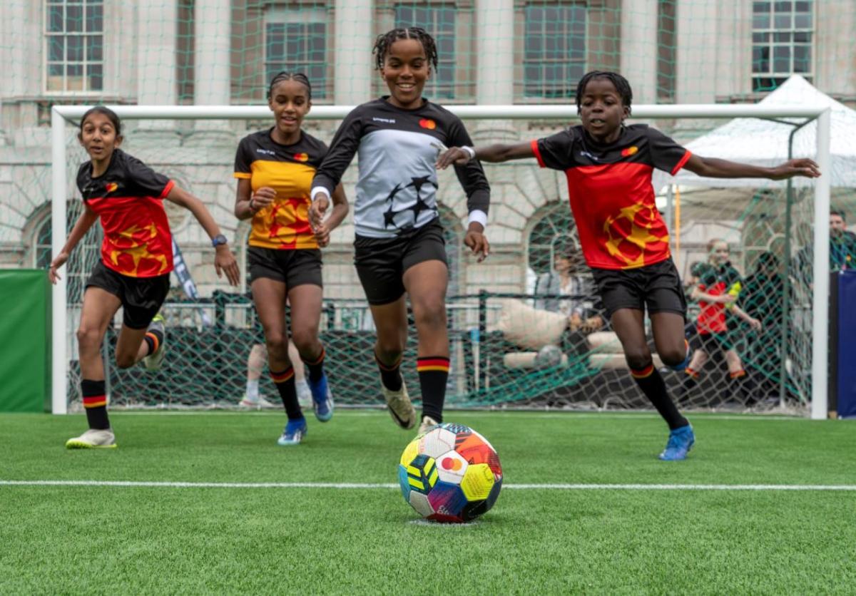 Children playing soccer.