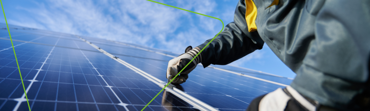 Close up of a person installing a solar panel.