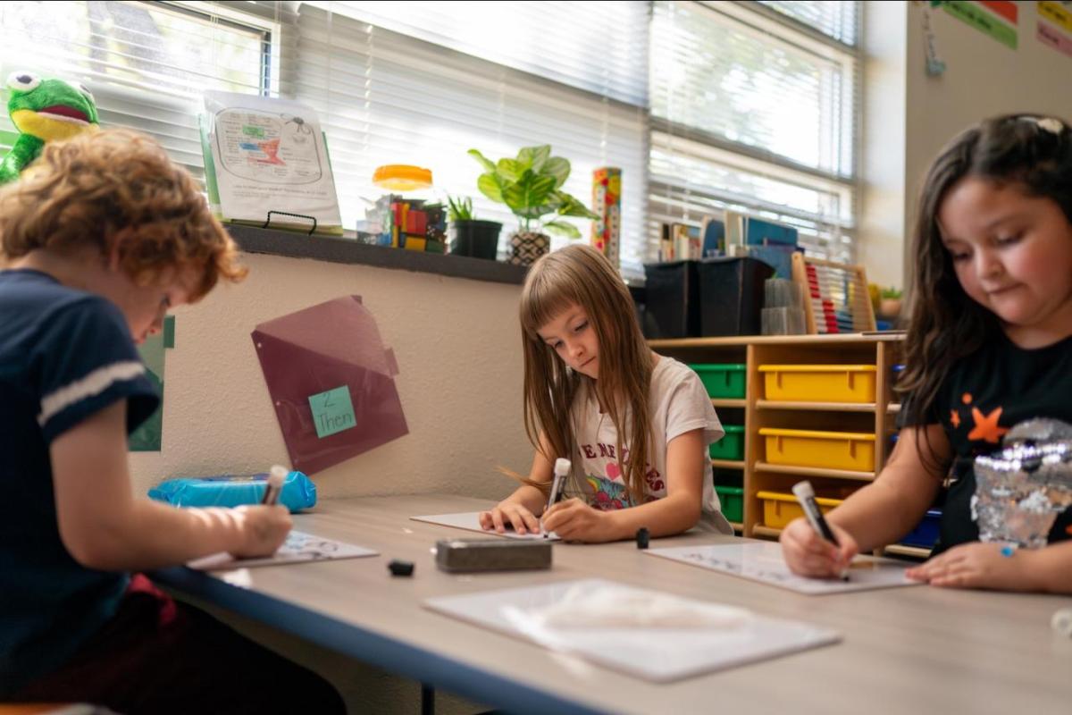 children learning in a classroom