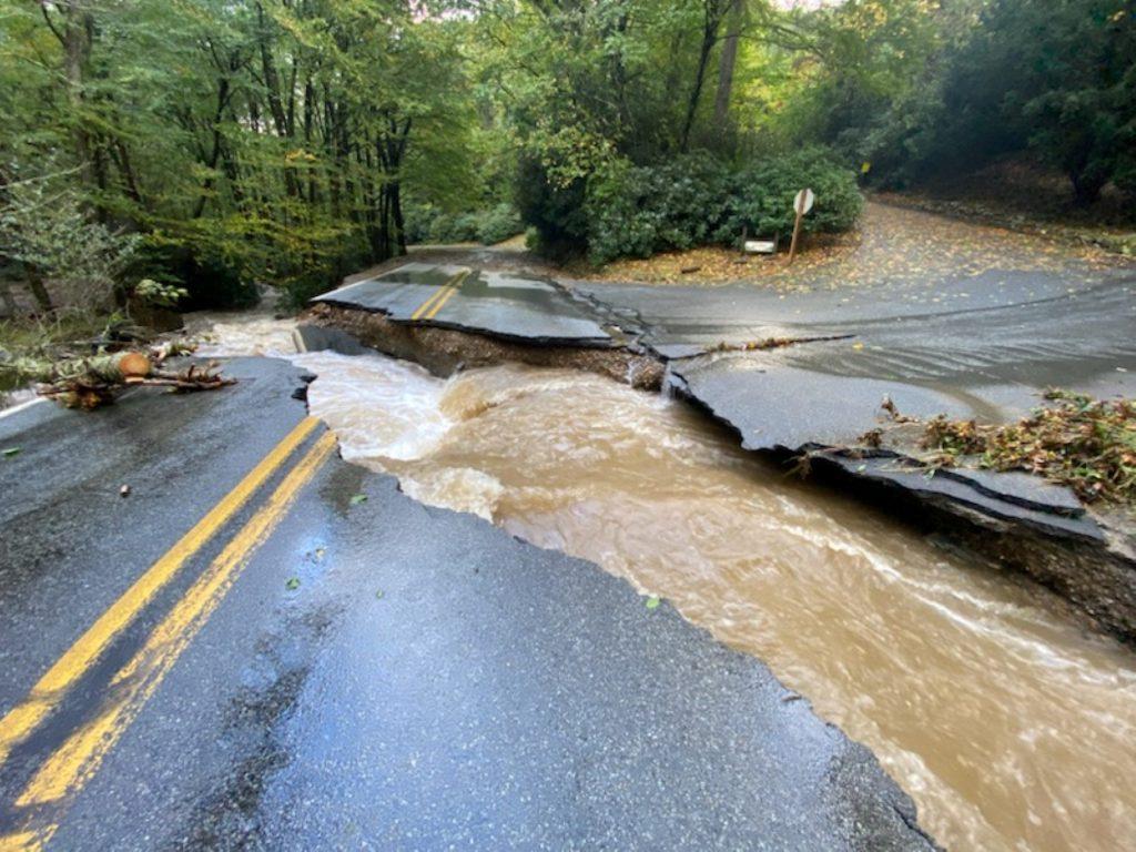 Flooding running through a broken road
