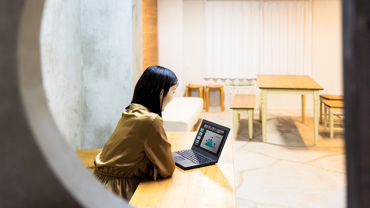 Woman looking at a laptop computer.