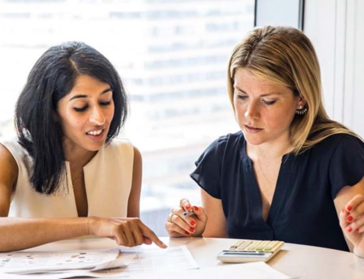 Tapestry employees collaborating at a round table