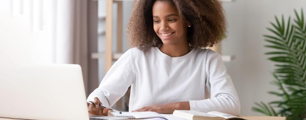 photo of young woman on a computer 