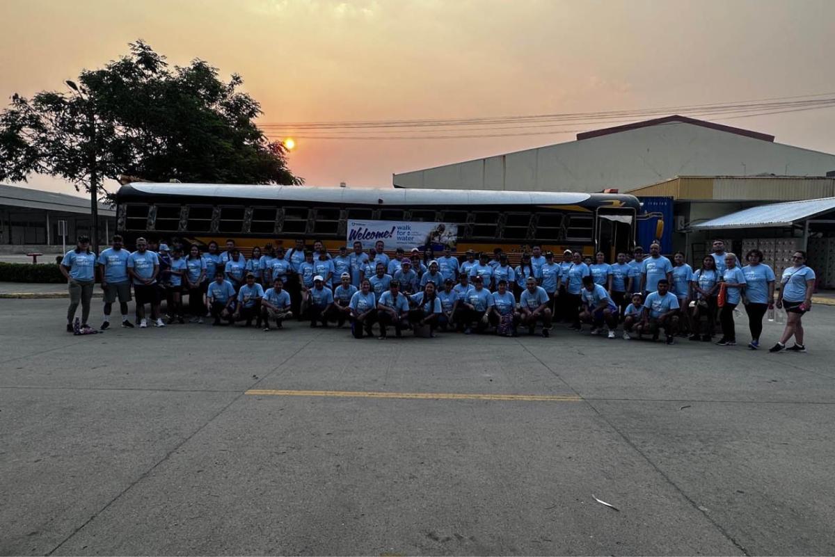 All the participants in front of a bus 