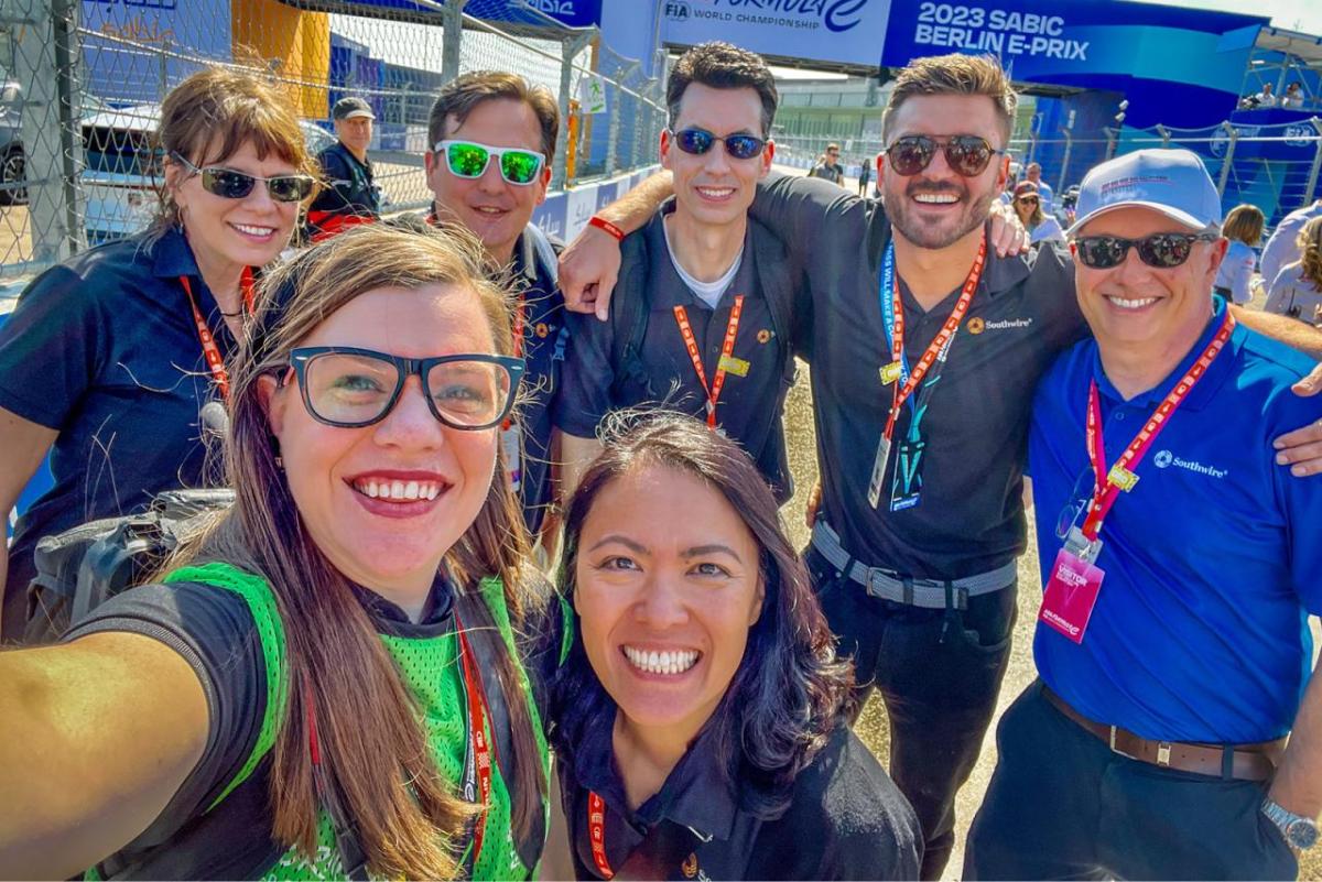 A group selfie, smiling people, most with Southwire shirts on.