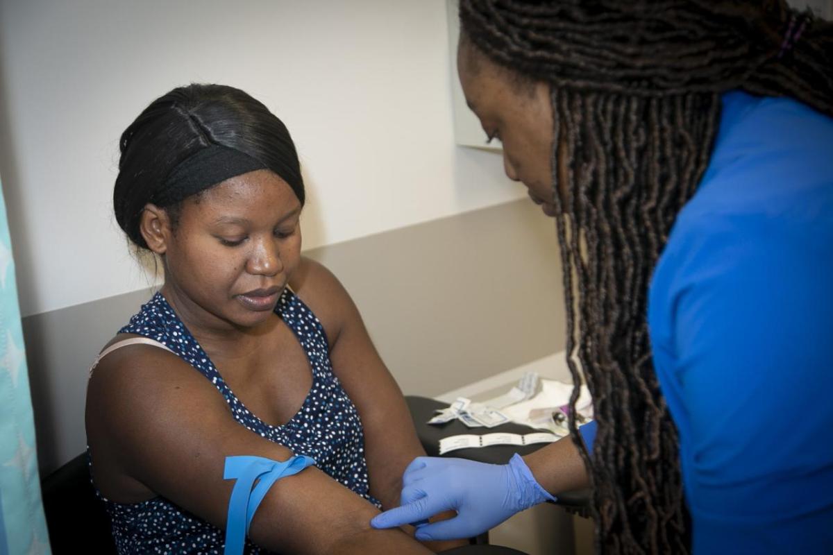 A health provider works with a patient at Healthcare Network of Southwest Florida. The clinic was one of four grantees to receive financial support to expand critical health services. (Courtesy photo) " "