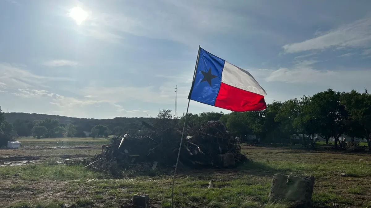 A flag waves in Hunt, Texas, on July 15, 2025, after floods inundated much of the Texas Hill County region. Direct Relief is working to support recovery in the region with emergency grant funds. (Shannon Hickerson/Direct Relief) A flag waves in Hunt, Texas, on July 15, 2025, after floods inundated much of the Texas Hill County region. Direct Relief is working to support recovery in the region with emergency grant funds. (Shannon Hickerson/Direct Relief)