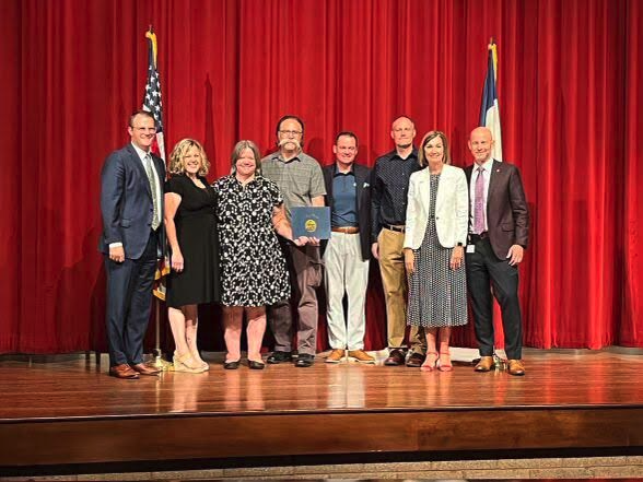 People standing on a stage together