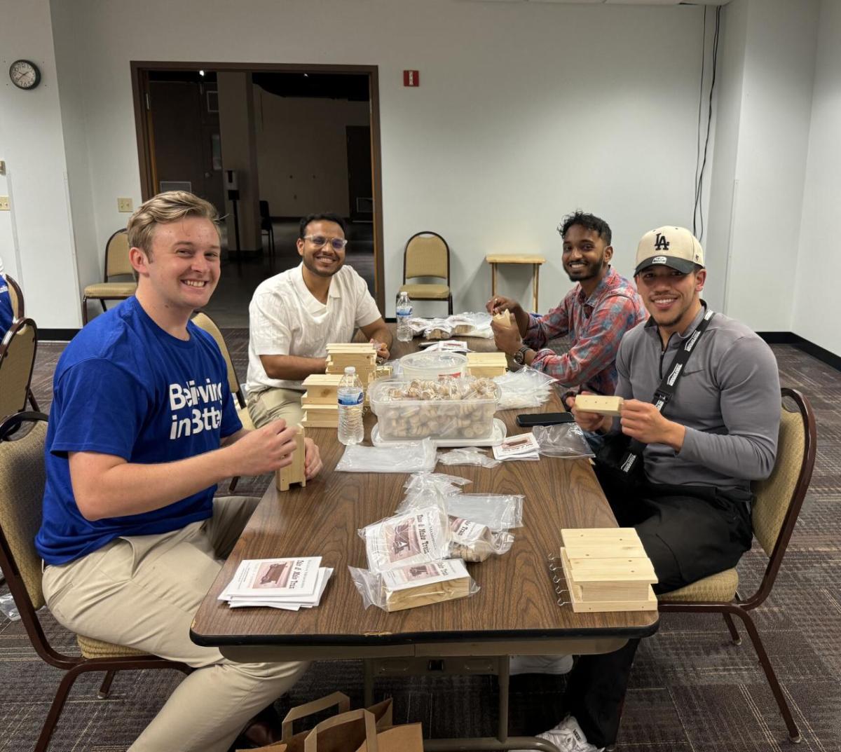 Volunteers pack bags at a table