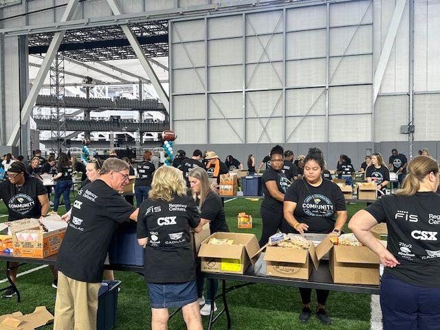 Volunteers sorting items in boxes