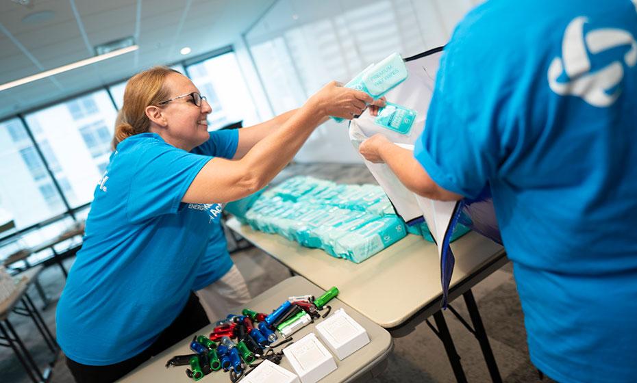 Duke Energy employee volunteer packing wet wipes 