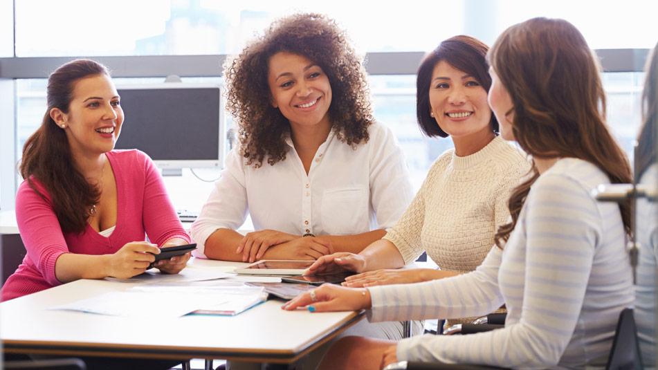 women sitting around an office table