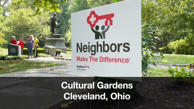 Sign in park reading, "Neighbors Make The Difference"