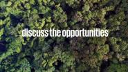 "discuss the opportunities" over an aerial view of a dense tree canopy.