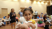 Young girl shown holding her Aflac Duck.