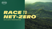 "Race to net-zero. Our climate transition plan." Over a green and forest canopy background.