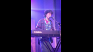 Olive Klug performing live on a keyboard.